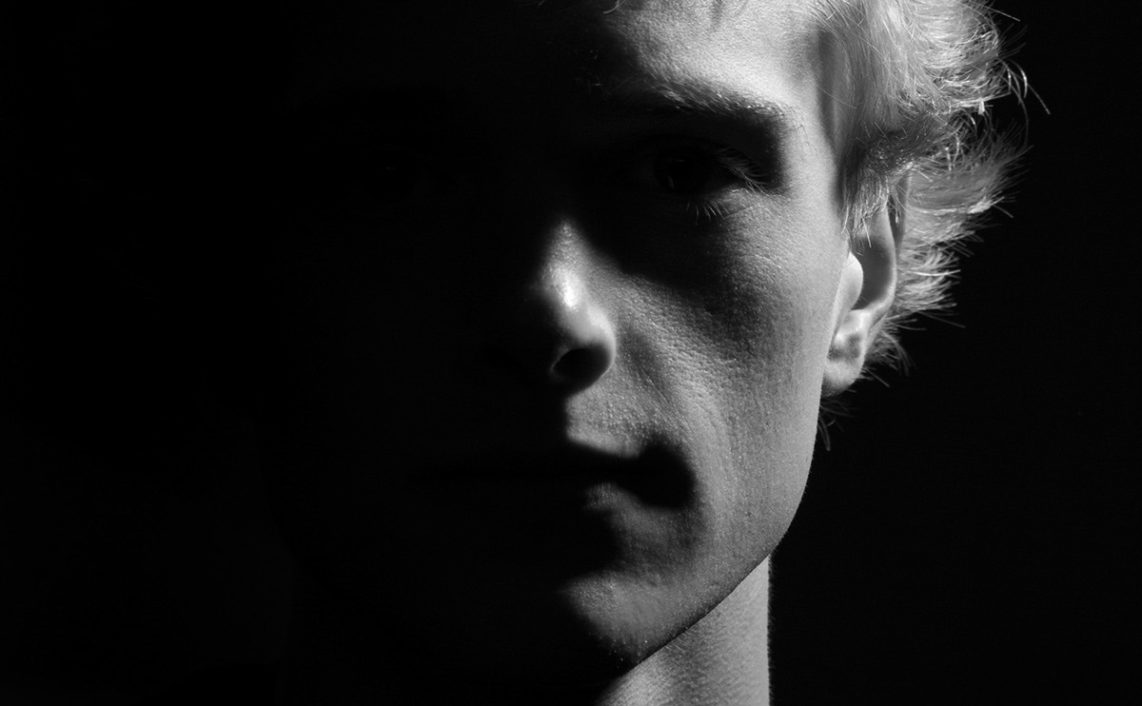 portrait with shadows obscuring subjects eyes
