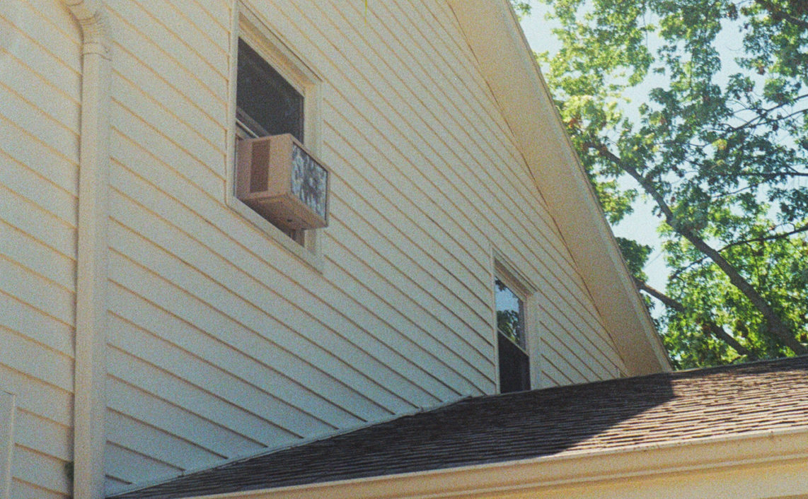 window ac unit on second story of house