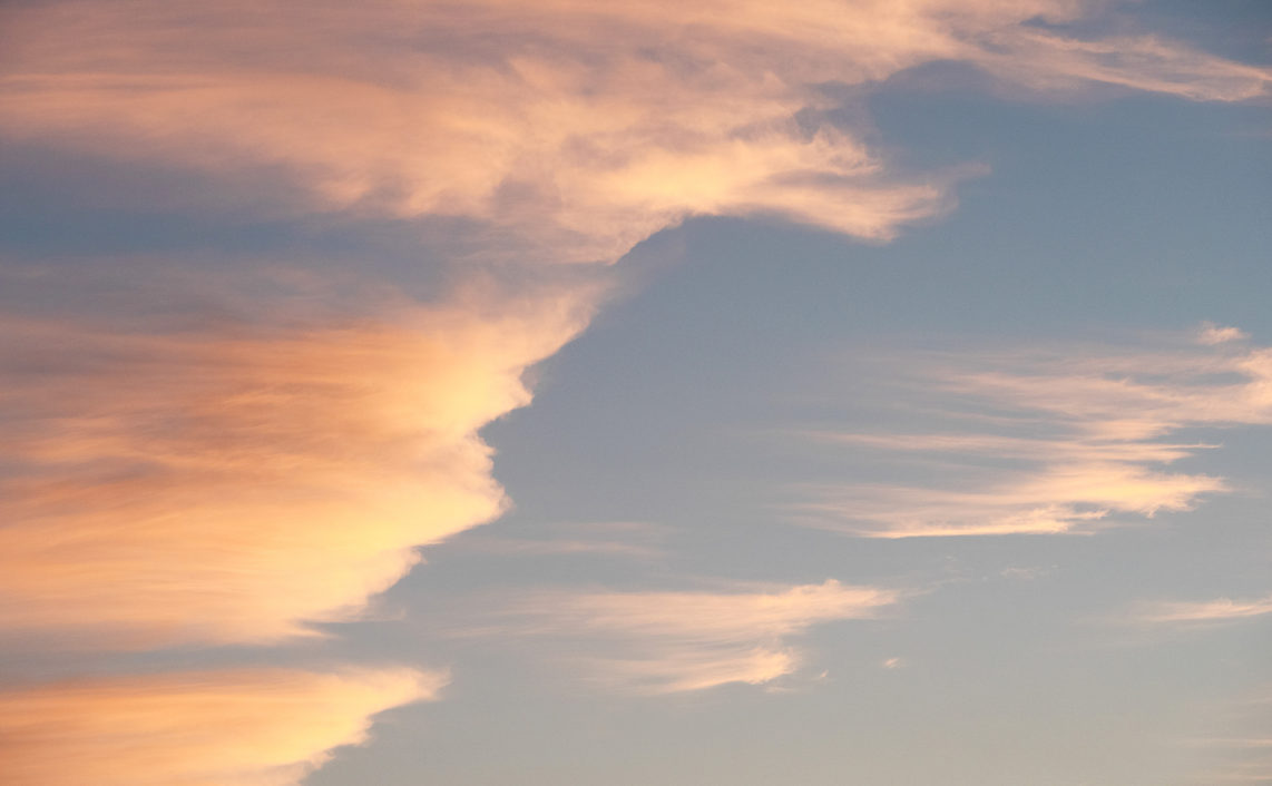orange clouds in the sky at sunset
